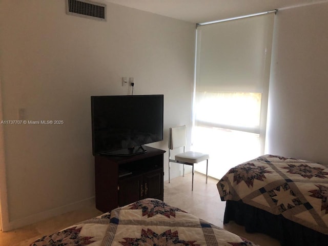 bedroom featuring visible vents