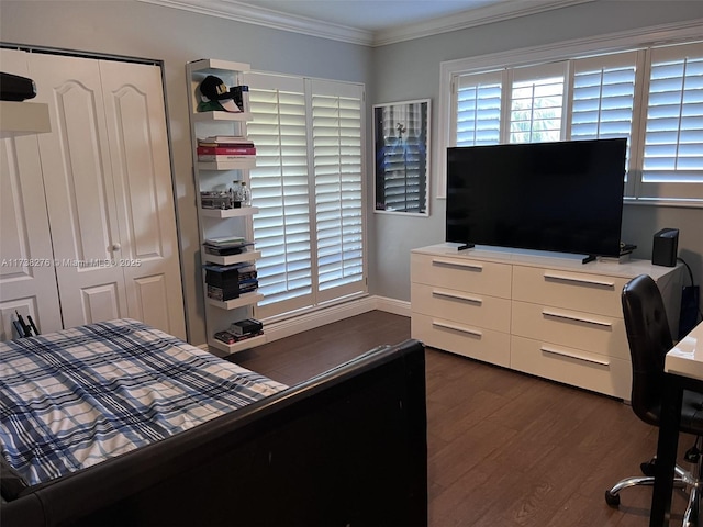 bedroom with crown molding and dark hardwood / wood-style floors