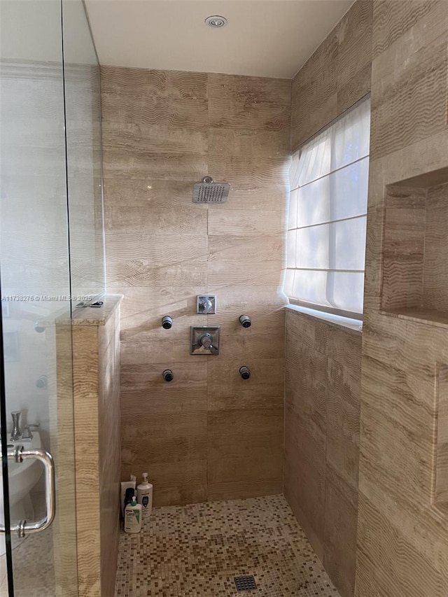 bathroom featuring an enclosed shower