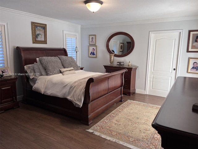 bedroom with dark wood-type flooring and crown molding