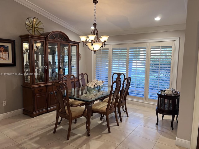 tiled dining area with ornamental molding and an inviting chandelier