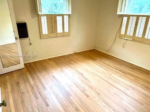 spare room featuring hardwood / wood-style flooring