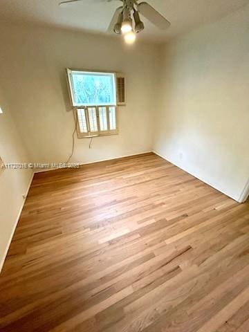 spare room featuring ceiling fan and light hardwood / wood-style floors