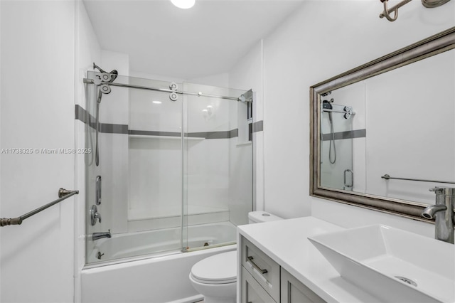 full bathroom with vanity, toilet, and combined bath / shower with glass door