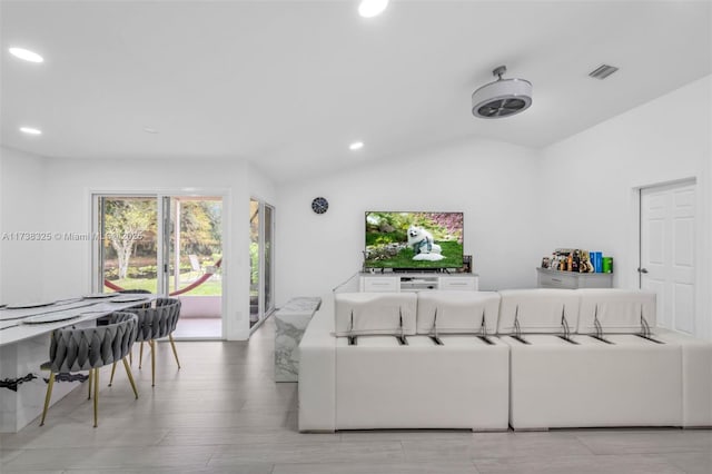 living room with vaulted ceiling