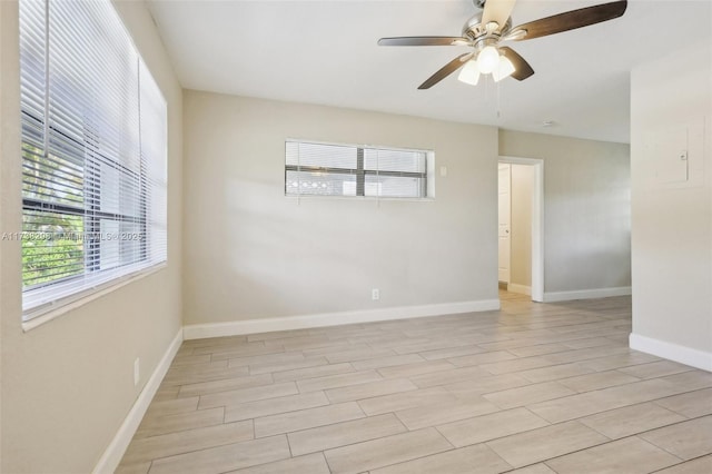 empty room featuring ceiling fan and light wood-type flooring