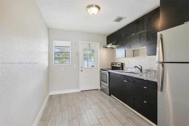 kitchen featuring stainless steel appliances and sink