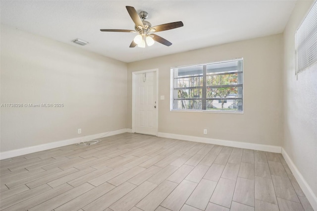 unfurnished room with ceiling fan and light wood-type flooring