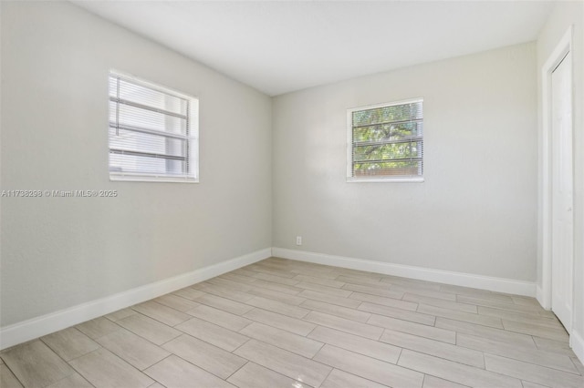 unfurnished room with light hardwood / wood-style flooring