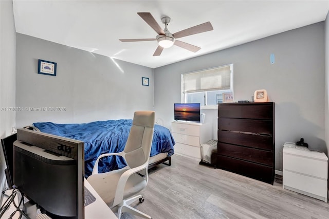 bedroom featuring light hardwood / wood-style flooring and ceiling fan