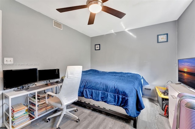 bedroom featuring hardwood / wood-style flooring and ceiling fan