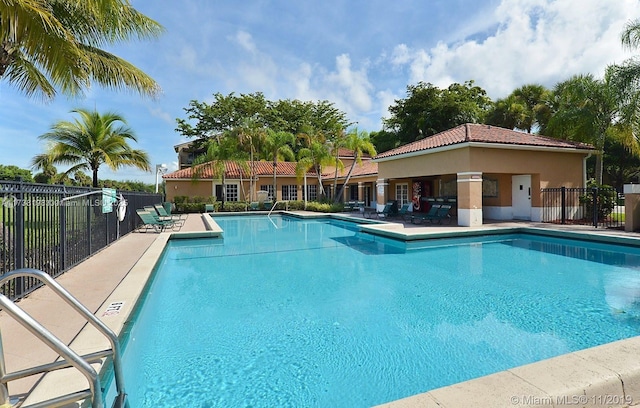 view of swimming pool with a patio area