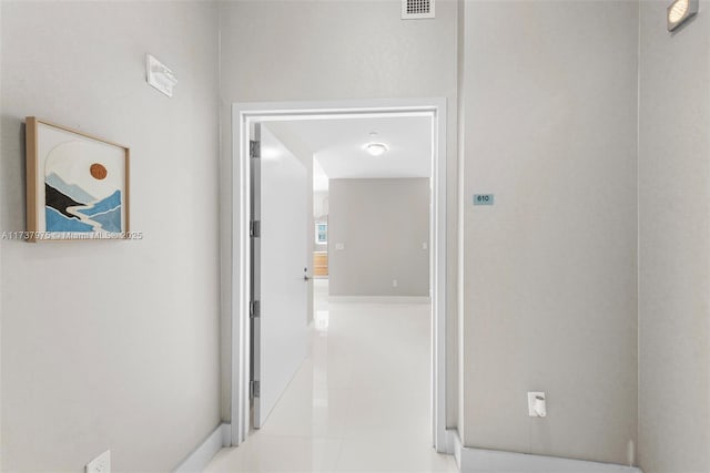 corridor featuring light tile patterned floors