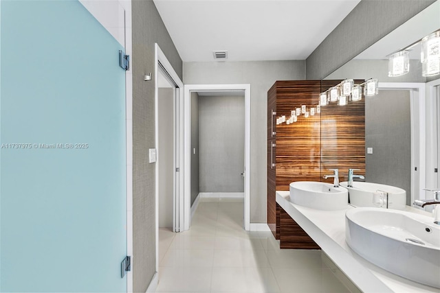 bathroom with vanity and tile patterned floors