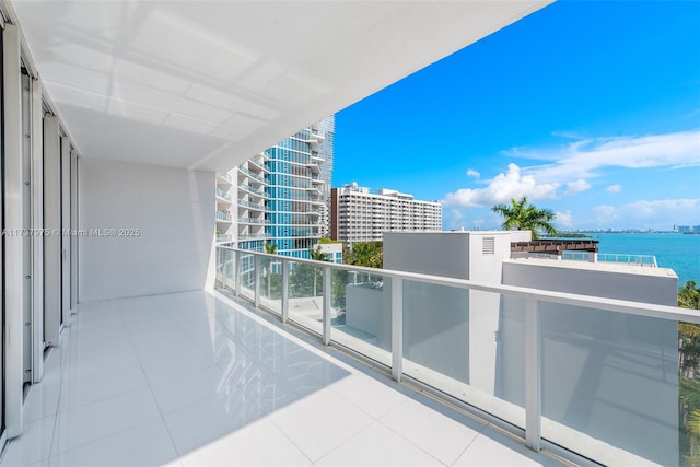 balcony featuring a water view