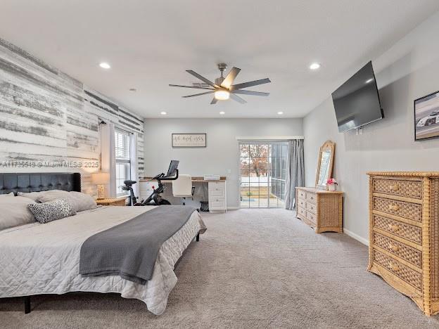 carpeted bedroom featuring ceiling fan