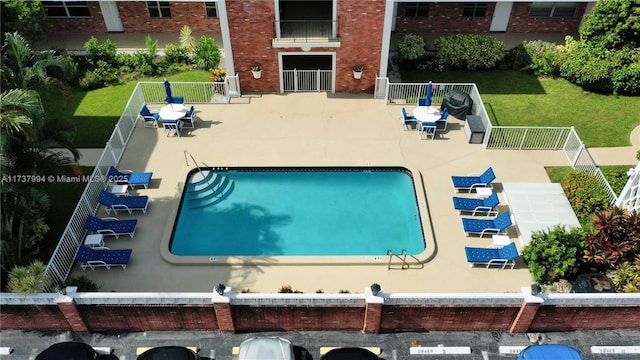 view of swimming pool featuring a patio