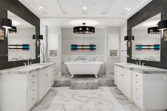 bathroom featuring tile walls, vanity, and a tub