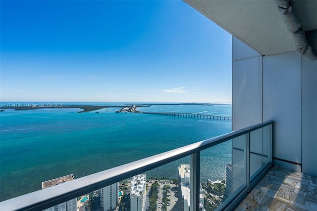 balcony featuring a water view