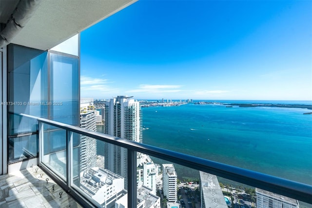 balcony featuring a water view