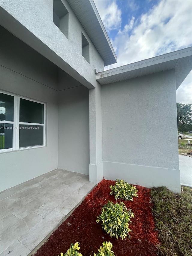 entrance to property with a patio