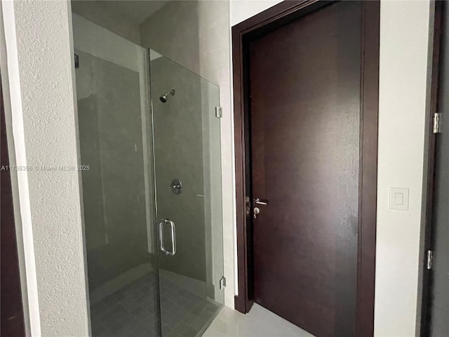 bathroom with a shower stall