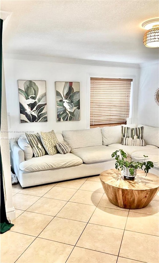 living room with light tile patterned floors and a textured ceiling