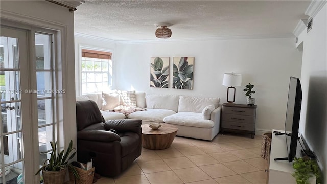 living room with light tile patterned floors, a textured ceiling, and crown molding