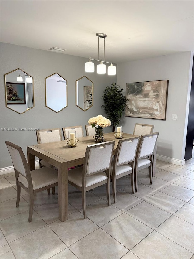 dining space with light tile patterned floors