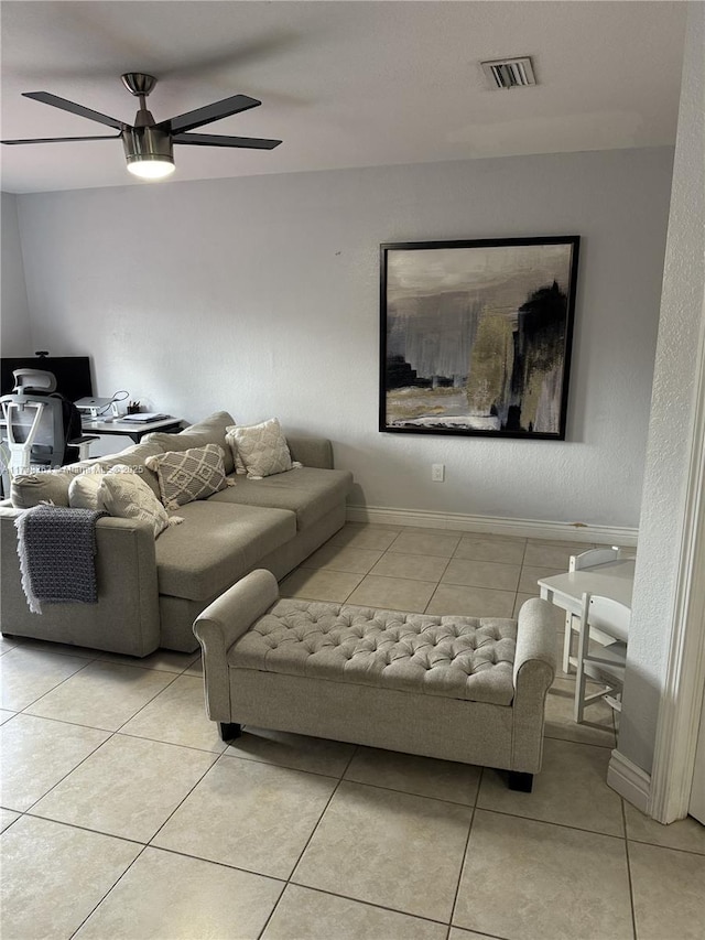 tiled living room with ceiling fan