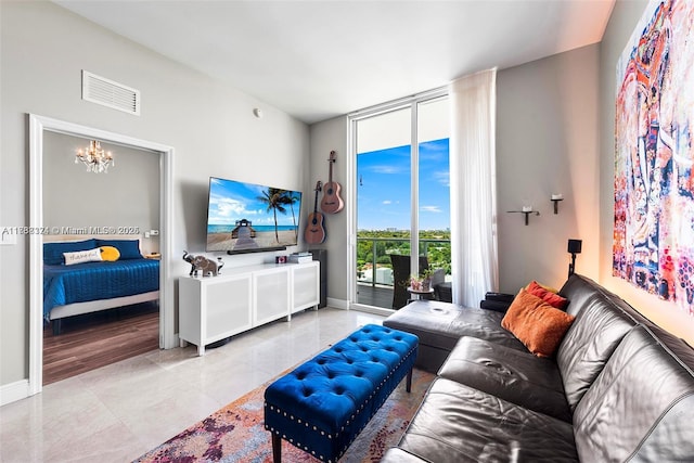 tiled living room with floor to ceiling windows and a notable chandelier