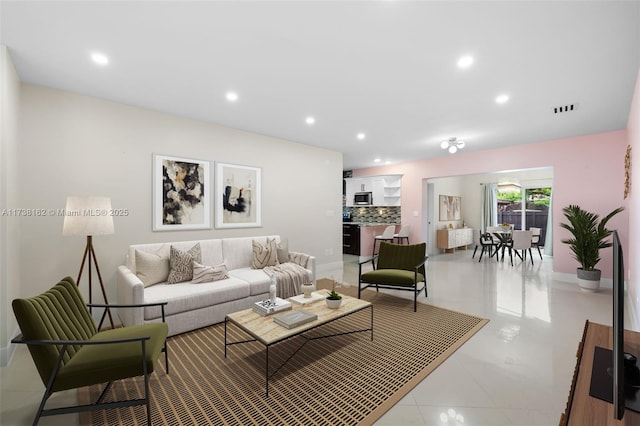 living room with light tile patterned floors