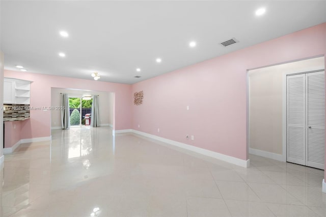 empty room with light tile patterned floors