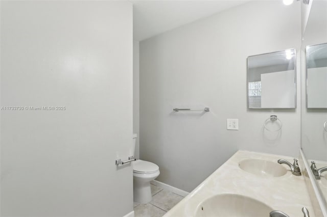 bathroom with vanity, tile patterned floors, and toilet