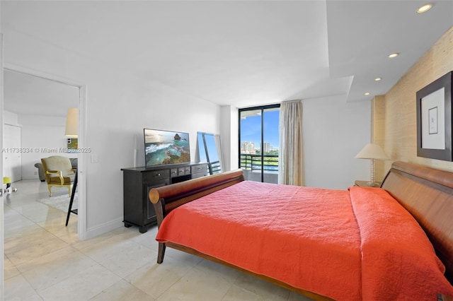 bedroom featuring expansive windows