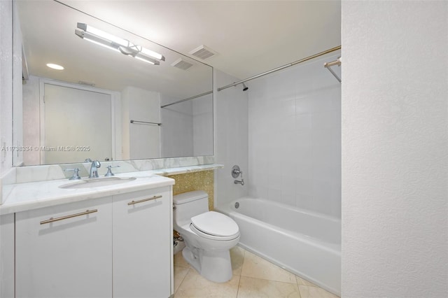 full bathroom featuring tiled shower / bath combo, vanity, tile patterned floors, and toilet