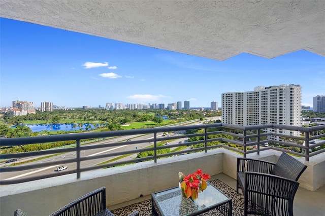 balcony featuring a water view