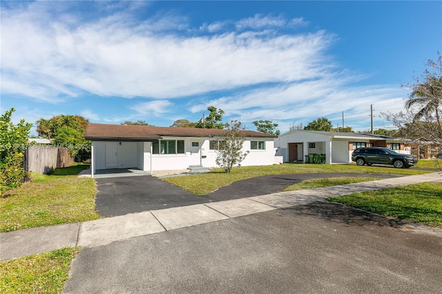 ranch-style home with a front lawn