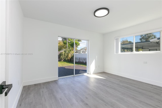 unfurnished room with light hardwood / wood-style flooring