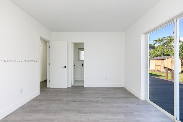 spare room featuring light hardwood / wood-style flooring