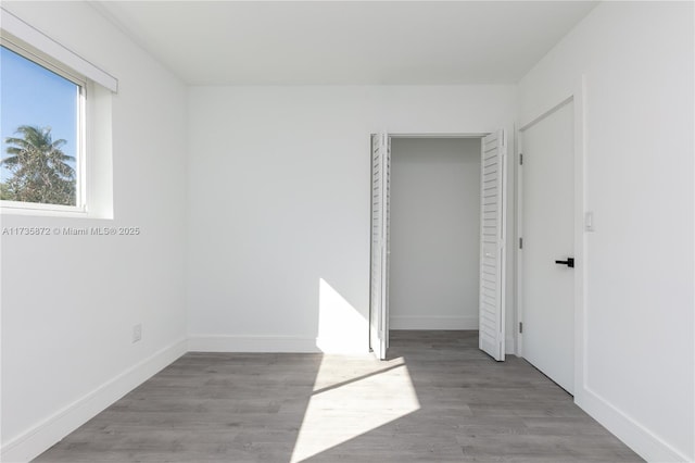 unfurnished room with light hardwood / wood-style flooring