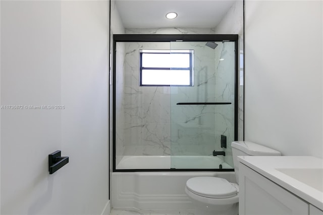 full bathroom with vanity, enclosed tub / shower combo, and toilet