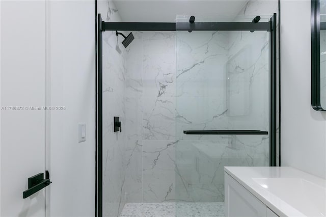 bathroom featuring vanity and an enclosed shower