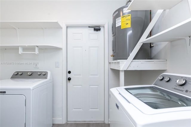 clothes washing area with washing machine and dryer