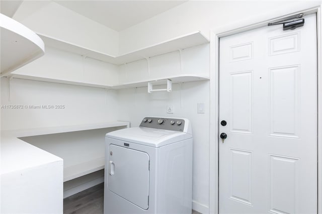 washroom featuring wood-type flooring and washer / dryer