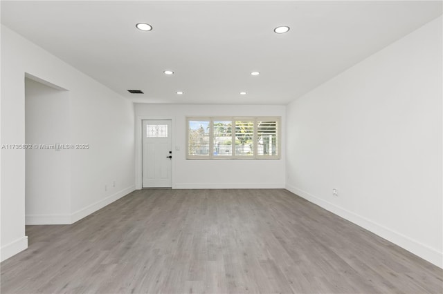 spare room with light wood-type flooring