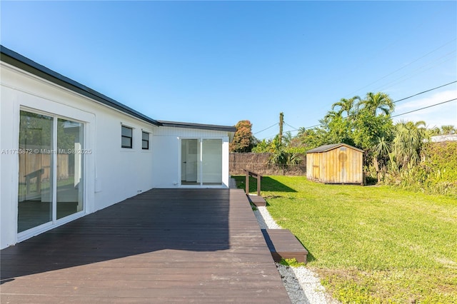 exterior space featuring a wooden deck and a storage shed