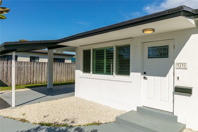 entrance to property with a patio area