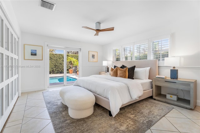 tiled bedroom featuring ceiling fan and access to outside