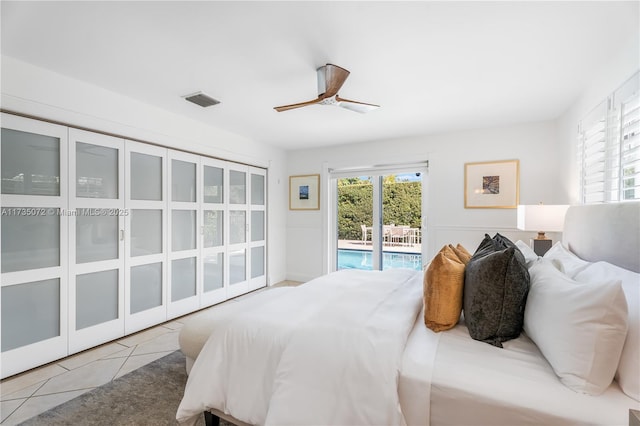 bedroom featuring light tile patterned floors, access to exterior, and ceiling fan